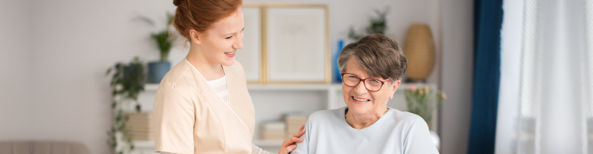 lady caregiver with senior people smiling